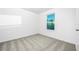 Bedroom featuring neutral carpet, bright white walls and a window for a clean and relaxing atmosphere at 13430 Leaping Water Way, Astatula, FL 34705