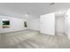 Large room with neutral carpet, bright white walls, two windows and a closet for a clean, spacious feel at 13430 Leaping Water Way, Astatula, FL 34705