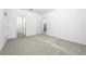 Bright carpeted bedroom with two open doorways at 13430 Leaping Water Way, Astatula, FL 34705