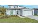 Charming home with a well-manicured lawn and a two-car garage, showcasing curb appeal at 13430 Leaping Water Way, Astatula, FL 34705