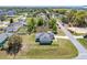 This home features a well-manicured lawn and an easy-to-maintain landscape at 13581 Sw 48Th Ct, Ocala, FL 34473