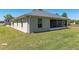 Lawn view of house and screened in porch at 13581 Sw 48Th Ct, Ocala, FL 34473