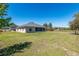 Expansive lawn, screened in porch and house at 13581 Sw 48Th Ct, Ocala, FL 34473