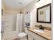 Well-lit bathroom featuring a shower-tub combination and vanity with granite countertop at 13581 Sw 48Th Ct, Ocala, FL 34473