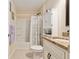 Bright bathroom with a shower-tub combination, modern fixtures, and granite countertops at 13581 Sw 48Th Ct, Ocala, FL 34473