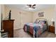 Inviting bedroom featuring plush carpeting, a ceiling fan, and plenty of natural light at 13581 Sw 48Th Ct, Ocala, FL 34473