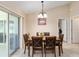 Neutral dining room with sliding doors to the lanai at 13581 Sw 48Th Ct, Ocala, FL 34473
