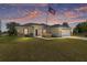 Inviting single-Gathering home boasting a lush lawn and a charming American flag at 13581 Sw 48Th Ct, Ocala, FL 34473
