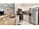 Modern kitchen with granite countertops and stainless steel appliances at 13581 Sw 48Th Ct, Ocala, FL 34473