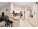 Charming kitchen with granite countertops, stainless steel appliances, and adjacent breakfast bar seating at 13581 Sw 48Th Ct, Ocala, FL 34473