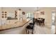 Eat-in kitchen featuring granite counters, stainless appliances, and bar-height seating at 13581 Sw 48Th Ct, Ocala, FL 34473