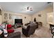 A warm and inviting living room featuring comfortable seating and neutral colors at 13581 Sw 48Th Ct, Ocala, FL 34473