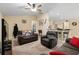 Inviting living room with plush seating, neutral tones, and a ceiling fan for a comfortable atmosphere at 13581 Sw 48Th Ct, Ocala, FL 34473
