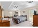 Spacious main bedroom features a tray ceiling and natural light at 13581 Sw 48Th Ct, Ocala, FL 34473