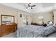 Main bedroom featuring tray ceiling and lanai access at 13581 Sw 48Th Ct, Ocala, FL 34473