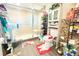 Bathroom with glass enclosed shower and toilet with colorful rug, plus storage cabinet and shelving at 2514 Sea Oats N Cir, Lakeland, FL 33815