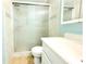 Bathroom featuring glass enclosed shower, tile walls and vanity with sink at 2514 Sea Oats N Cir, Lakeland, FL 33815