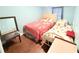 Bedroom featuring wood-look floors with two twin beds and neutral walls at 2514 Sea Oats N Cir, Lakeland, FL 33815