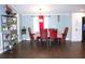 Inviting dining area with elegant decor, featuring rich wood floors and seating for six at 2514 Sea Oats N Cir, Lakeland, FL 33815