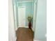 Hallway with tile flooring, leading to rooms featuring interior doors and pastel colored walls at 2514 Sea Oats N Cir, Lakeland, FL 33815