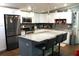 Beautiful kitchen with stainless steel appliances, granite countertops, and a center island with bar seating at 2514 Sea Oats N Cir, Lakeland, FL 33815