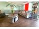 Comfortable living area showcases stylish decor and wood-look floors, creating a cozy atmosphere at 2514 Sea Oats N Cir, Lakeland, FL 33815