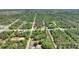 Panoramic aerial shot highlights the home's location amid natural surroundings at 2971 Gardenia Dr, Indian Lake Estates, FL 33855