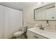 Cozy bathroom featuring a single sink vanity with tiled backsplash and a shower/tub combo at 2971 Gardenia Dr, Indian Lake Estates, FL 33855