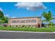 Welcome to Indian Lake Estates! Beautiful community sign with lush landscaping at 2971 Gardenia Dr, Indian Lake Estates, FL 33855