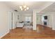 Bright and airy living room with wood floors and comfortable seating at 2971 Gardenia Dr, Indian Lake Estates, FL 33855