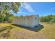 Versatile outbuilding with durable siding, secure doors, and functional lighting, ideal for storage or hobbies at 2971 Gardenia Dr, Indian Lake Estates, FL 33855