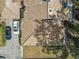 Aerial view of a home featuring a tile roof, driveway, and backyard at 4524 Oak Arbor Cir, Orlando, FL 32802