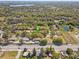 An aerial image of a residential community with a pond in close proximity at 4524 Oak Arbor Cir, Orlando, FL 32802