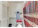 Bathroom featuring decorative toilet, curtained shower, and storage space at 4524 Oak Arbor Cir, Orlando, FL 32802