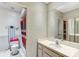 Bathroom with wallpaper, vanity, a toilet and shower with curtain at 4524 Oak Arbor Cir, Orlando, FL 32802