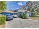 Charming home with a tile roof, and spacious driveway with ample parking at 4524 Oak Arbor Cir, Orlando, FL 32802