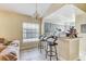 Eat in kitchen featuring sleek black bar stools, tile floors and gray cabinets at 4524 Oak Arbor Cir, Orlando, FL 32802