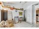 Bright living room with tile flooring, ample storage, and sliding door access to another room at 4524 Oak Arbor Cir, Orlando, FL 32802