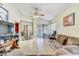 Open living room with wood flooring, fan and sliding glass doors at 4524 Oak Arbor Cir, Orlando, FL 32802