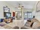 Open living room with hardwood floors, ceiling fan and sliding glass doors at 4524 Oak Arbor Cir, Orlando, FL 32802