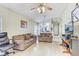 Spacious living room filled with natural light, hardwood floors, and modern ceiling fan at 4524 Oak Arbor Cir, Orlando, FL 32802