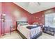 Cozy main bedroom featuring carpet floors and a large window at 4524 Oak Arbor Cir, Orlando, FL 32802