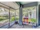 Enclosed patio space, ideal for enjoying the outdoors with a view of the yard and neighborhood at 4524 Oak Arbor Cir, Orlando, FL 32802