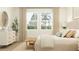 Bright bedroom with a dresser, bench, and large windows, creating a relaxing atmosphere at 4566 Ochos Rios Pl, Kissimmee, FL 34758