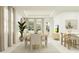 Inviting dining area with stylish seating, natural light, and open-concept design connected to the living spaces at 4566 Ochos Rios Pl, Kissimmee, FL 34758