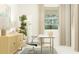 Bright home office with a modern desk, a comfortable chair, and natural light from the window at 4566 Ochos Rios Pl, Kissimmee, FL 34758
