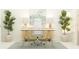 Stylish home office featuring a white desk, a comfortable chair, and vibrant potted plants at 4566 Ochos Rios Pl, Kissimmee, FL 34758