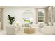 Bright and airy living room with plush seating, modern decor, and natural light streaming in at 4566 Ochos Rios Pl, Kissimmee, FL 34758