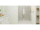 Modern bathroom featuring a glass-enclosed shower and stylish vanity, providing a spa-like experience at 4578 Ochos Rios Pl, Kissimmee, FL 34758