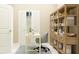 Bright home office with built-in shelving and a neat desk setup provides a perfect work-from-home environment at 4578 Ochos Rios Pl, Kissimmee, FL 34758